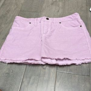 Pinkish purple jean shorts, size 6 for women.
